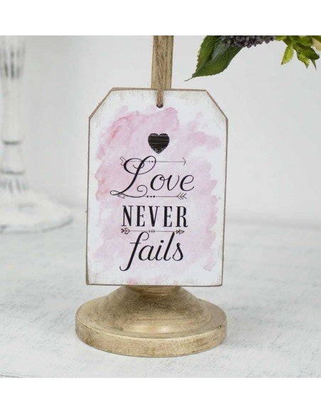 Plaque à suspendre Love Never Fails